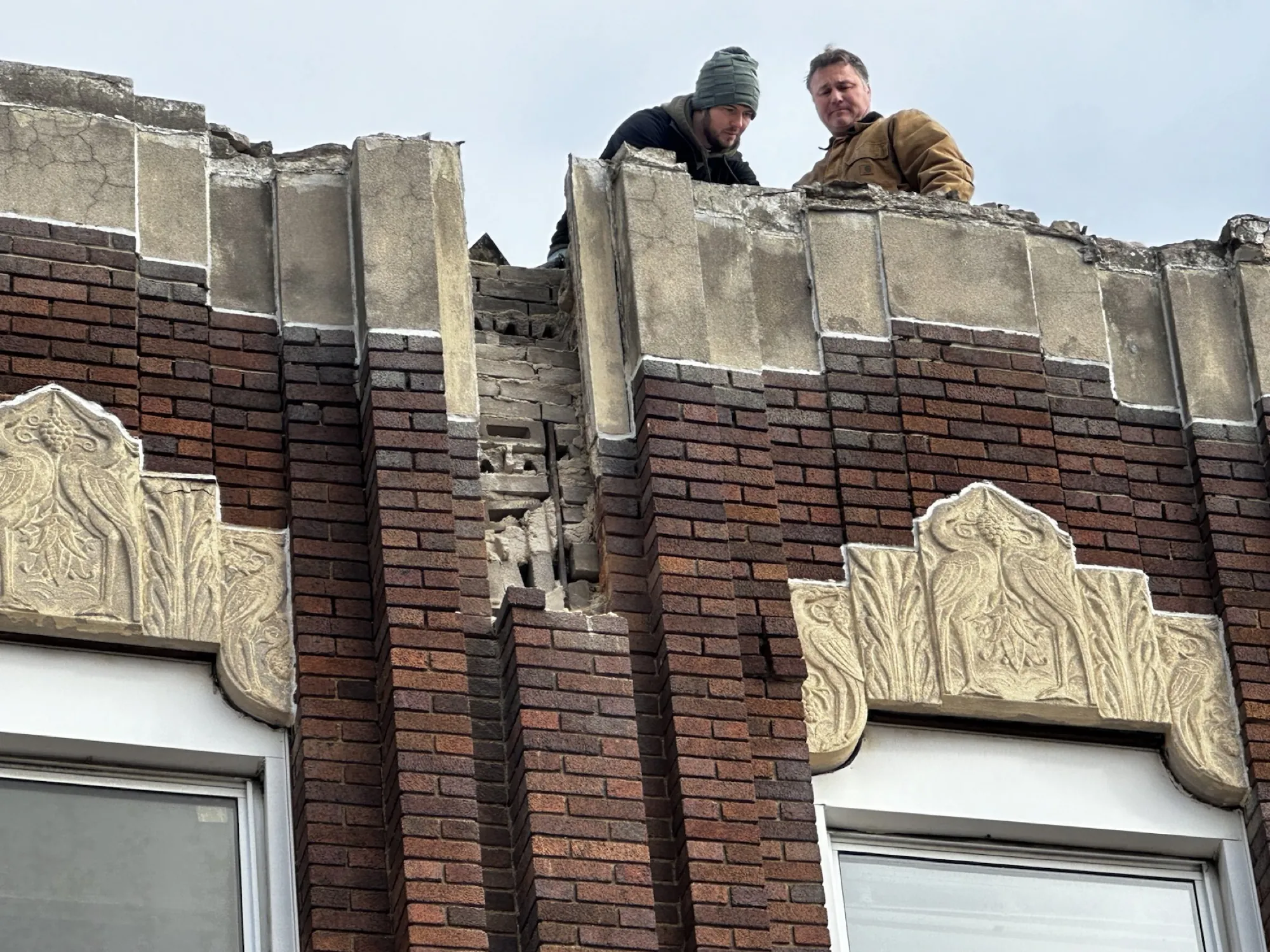 Field investigation with the mason contractor, confirming that the cornice could not be saved in place.