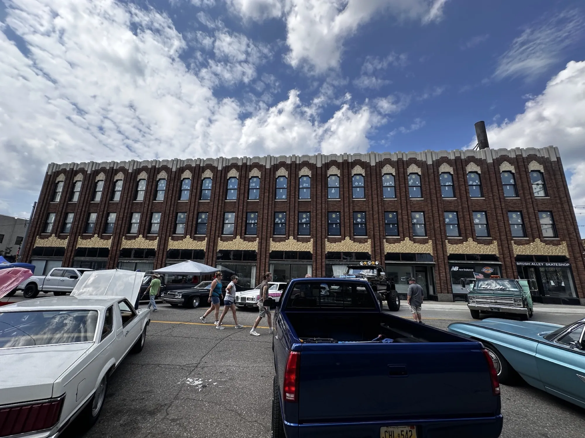 Back to work: the building as a backdrop to a downtown Flint car show, summer 2024.