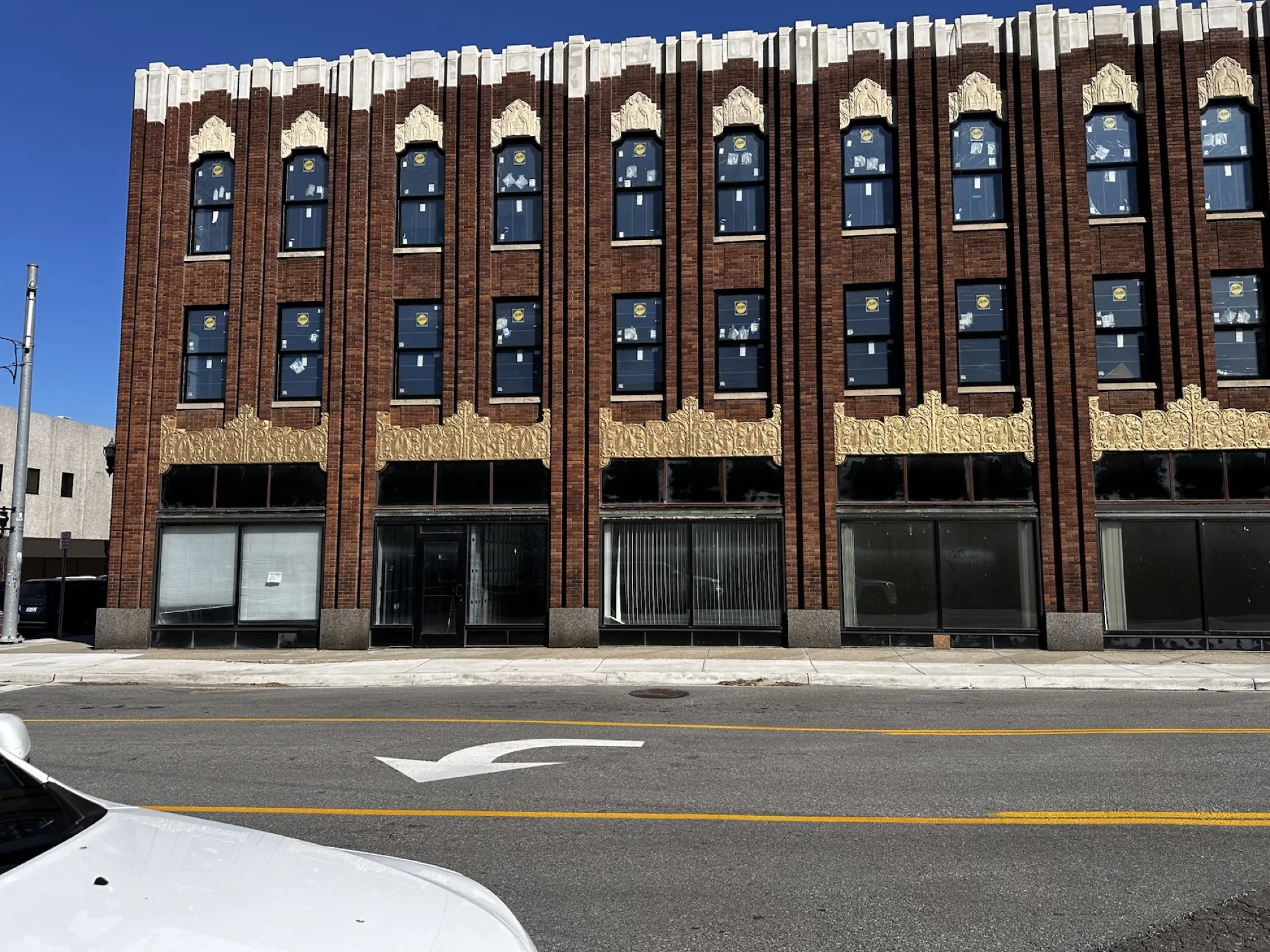 After — the Third Street elevation, cornice restored across every bay.